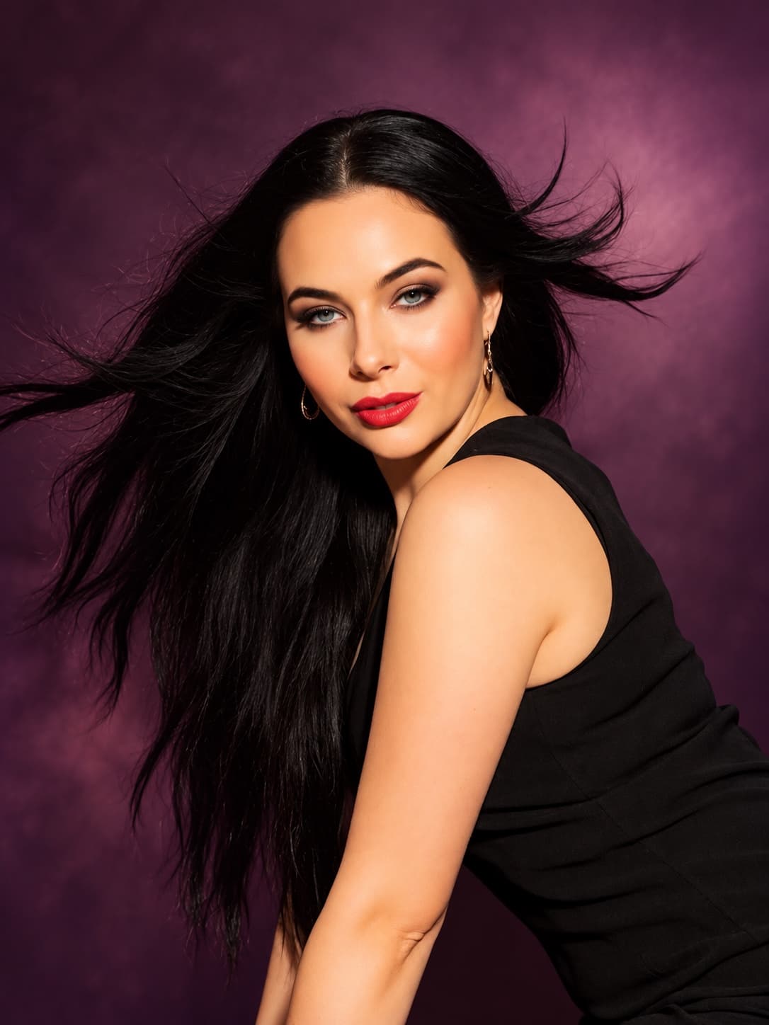 Katherine, photographed against a deep plum background